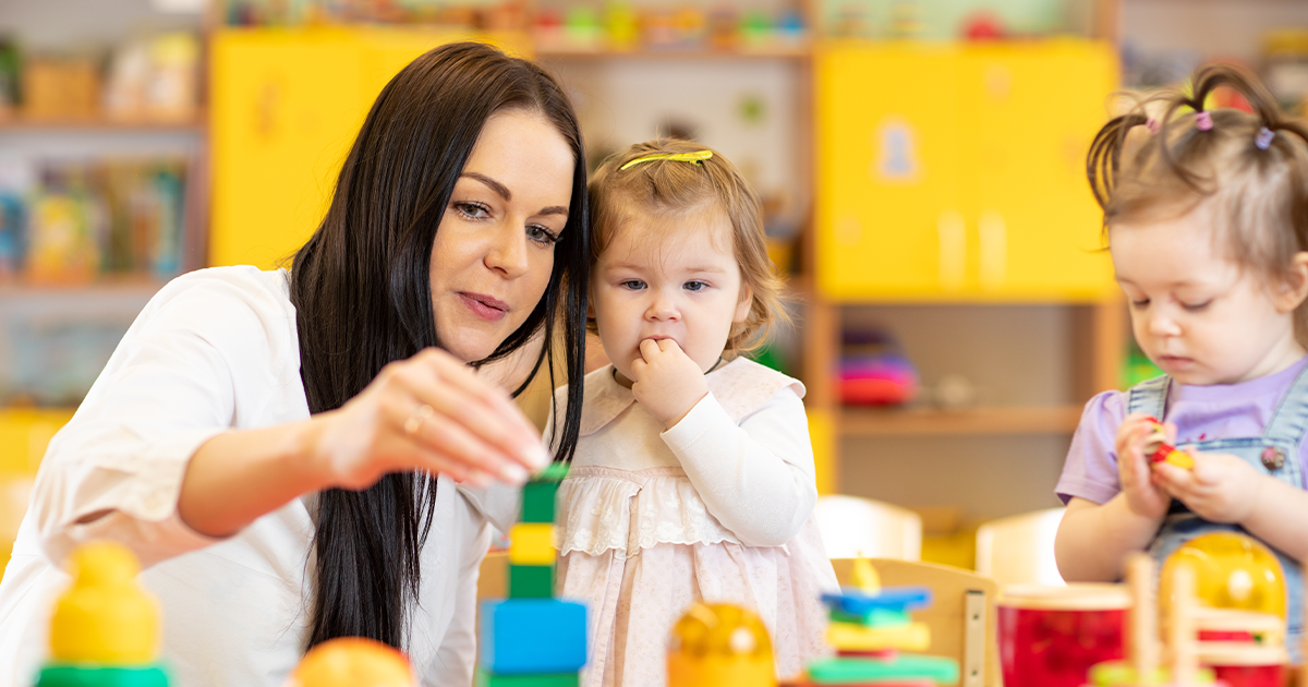 Image of early childhood educator in classroom setting.