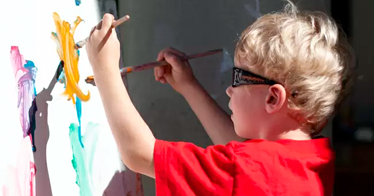 Photo of toddler painting.