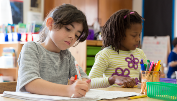 Two young students in classroom