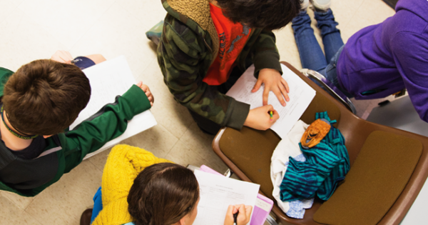 Group of children working together on assignment