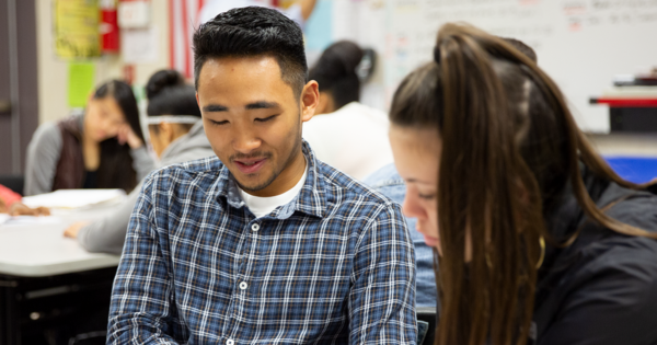 Photo of high school students working together.